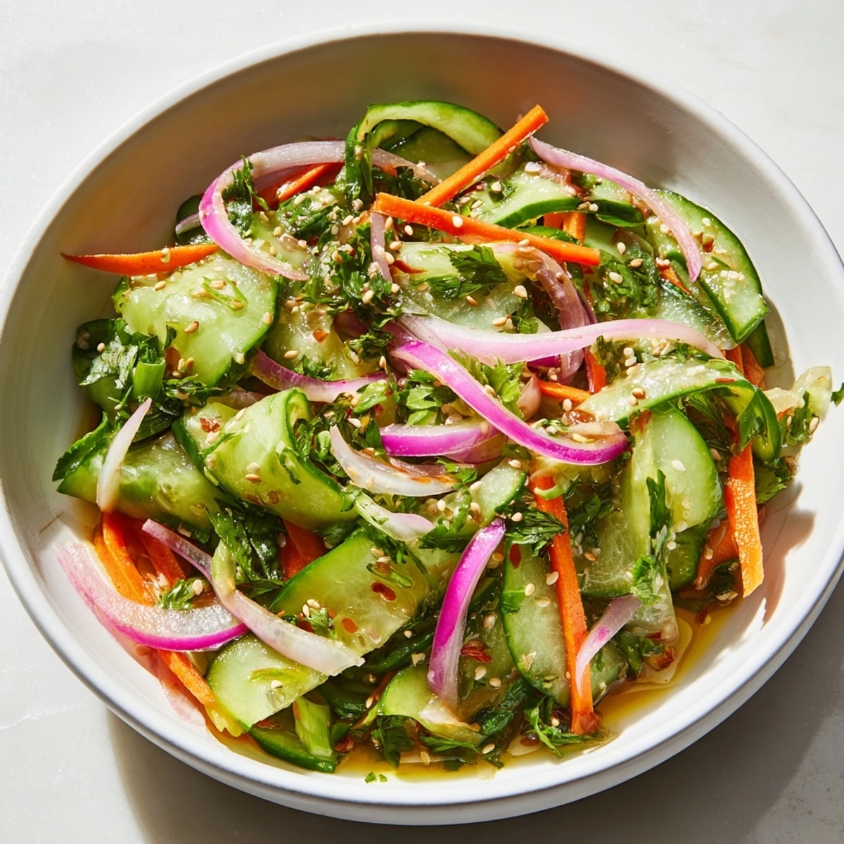 Bright and tangy Cucumber Salad Remix, a vibrant Asian-inspired dish with sliced cucumbers.