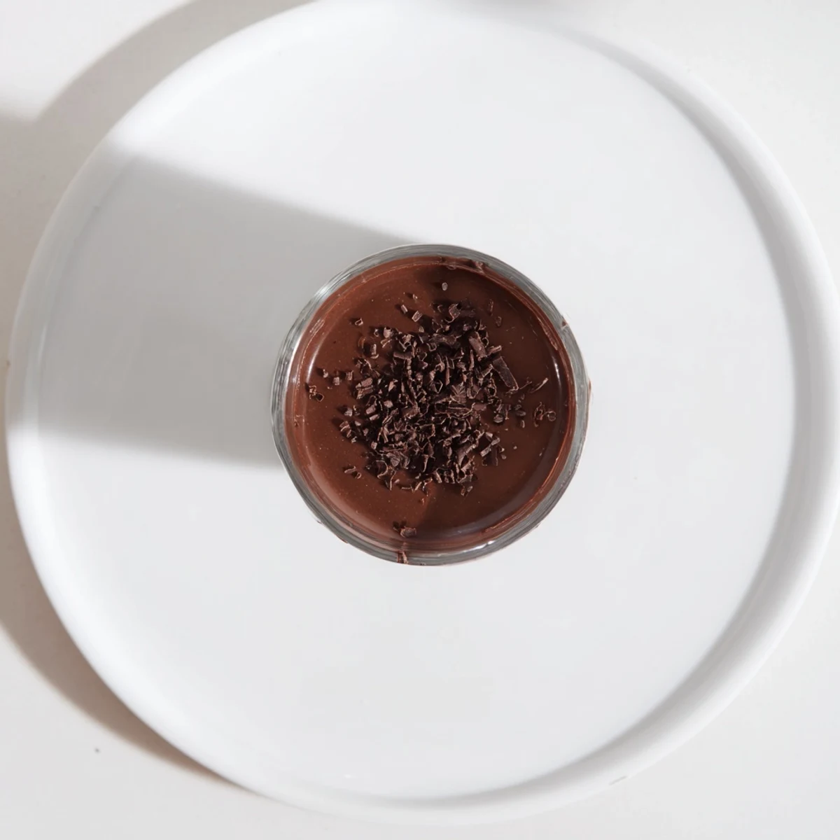 Dark, smooth shot chocolate, topped with whipped cream, ready to serve and indulge.