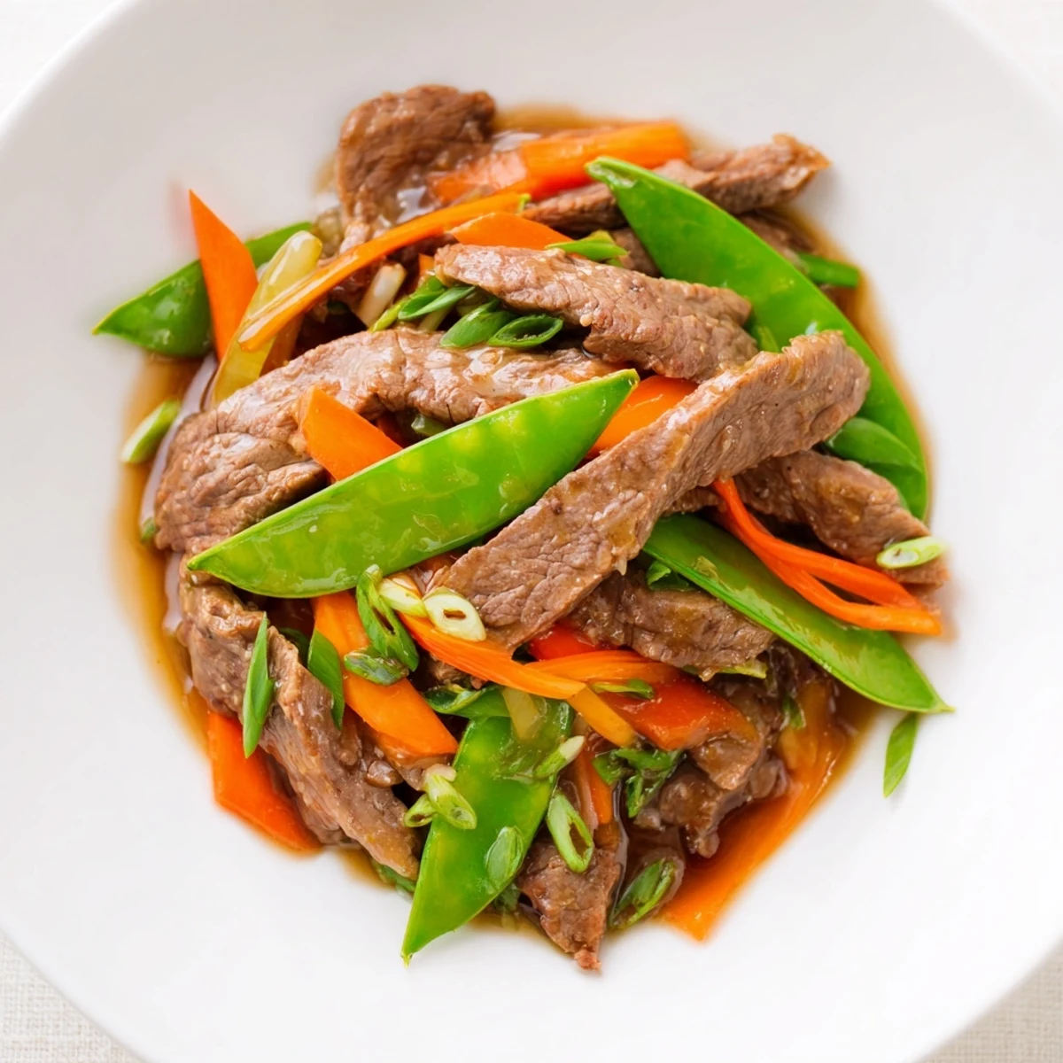 Delicious Beef Stir Fry: Sizzling tender beef, crisp vegetables coated with a rich, aromatic sauce.
