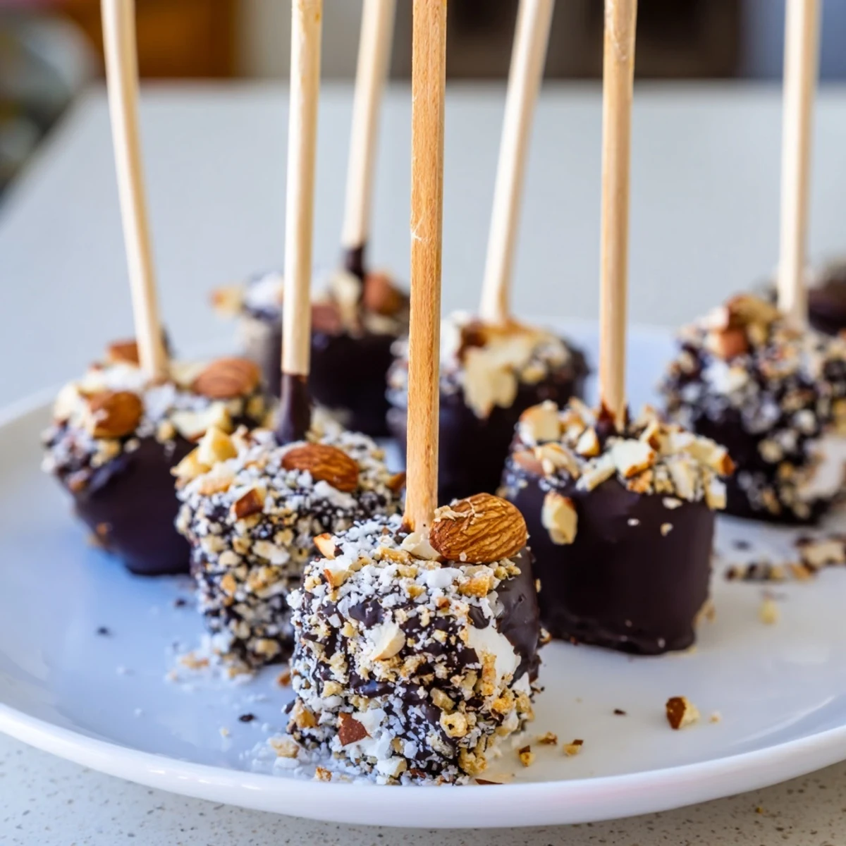 Rich, dark chocolate-coated marshmallows chilled to a smooth finish, garnished with crushed graham crackers.