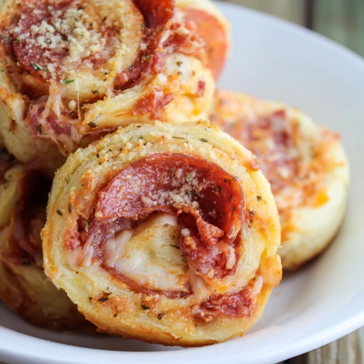 Freshly baked Game Day Pizza Rolls with Beef Pepperoni, golden brown and bubbling with melted mozzarella and cheddar.