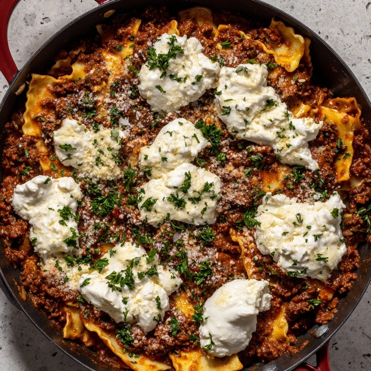 This Skillet Lasagna features broken lasagna noodles simmered in a rich tomato base.
