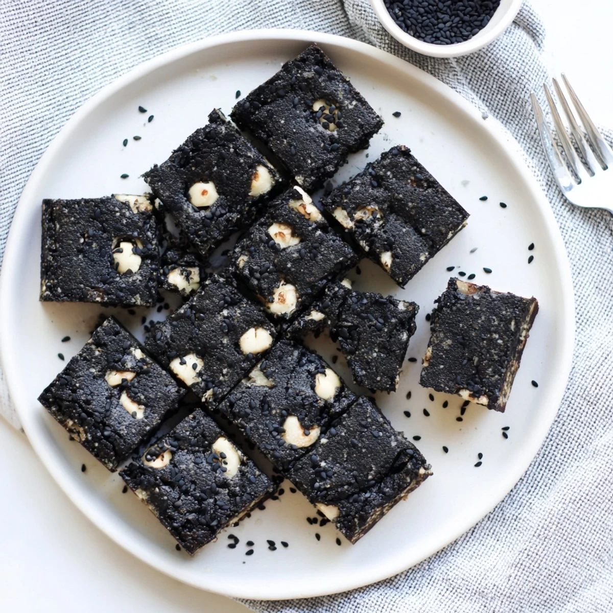 Freshly baked Black Sesame Blondies with buttery golden edges and a rich, nutty aroma ready to be served.