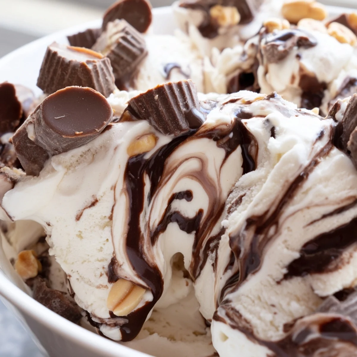 Frozen dessert bowl featuring homemade moose tracks ice cream with chocolate fudge swirls and candy mix-ins