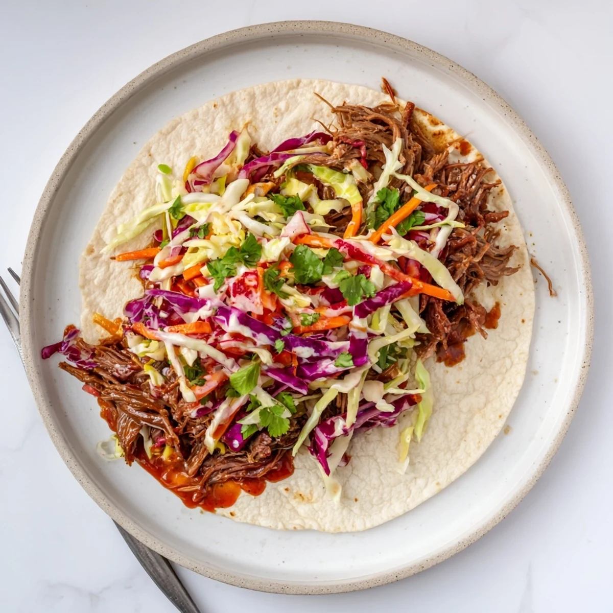 Easy sweet smoky BBQ pulled beef slaw wraps featuring juicy shredded beef and crisp vegetable coleslaw
