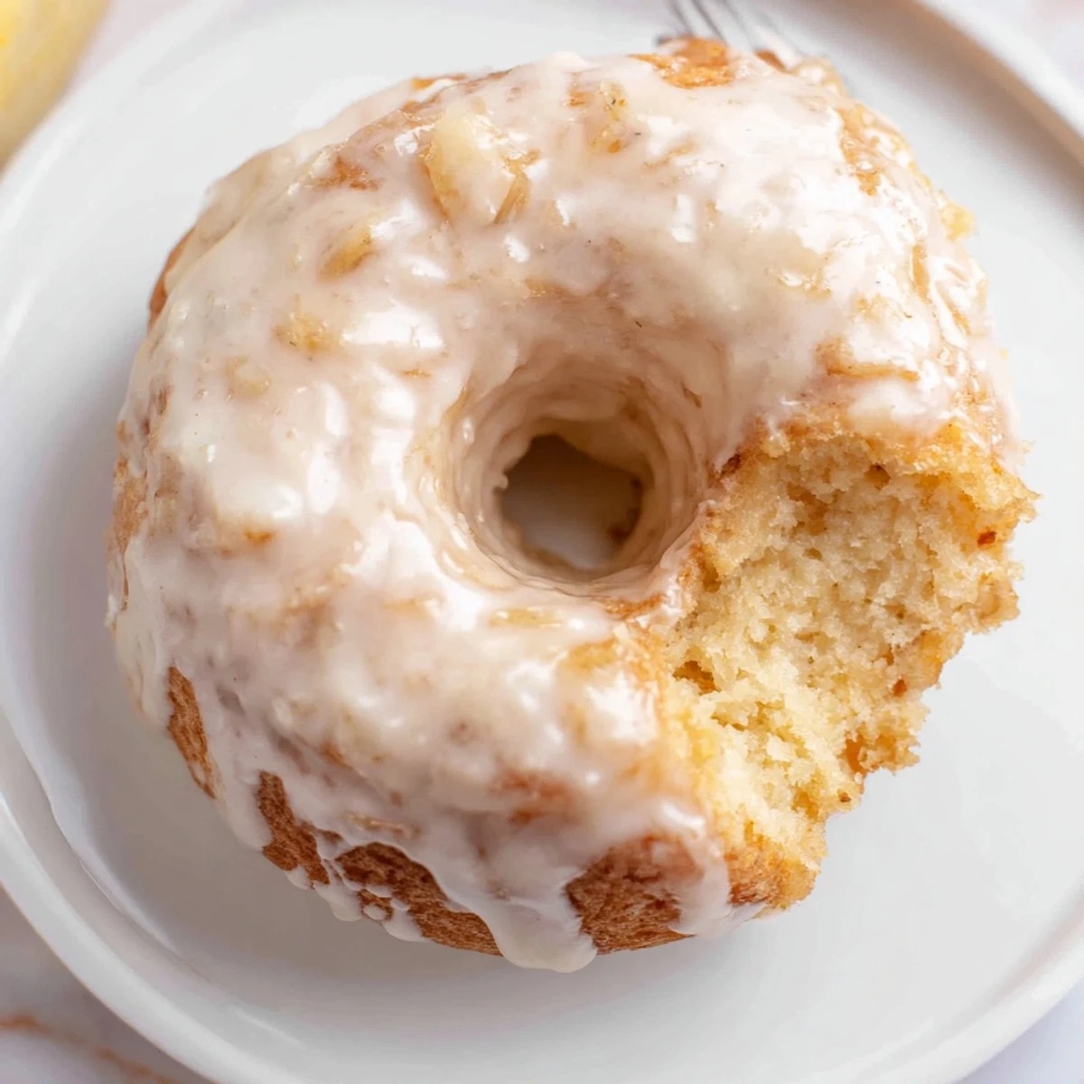 Fresh baked Banana Donuts cooling on a rack, tender cake texture