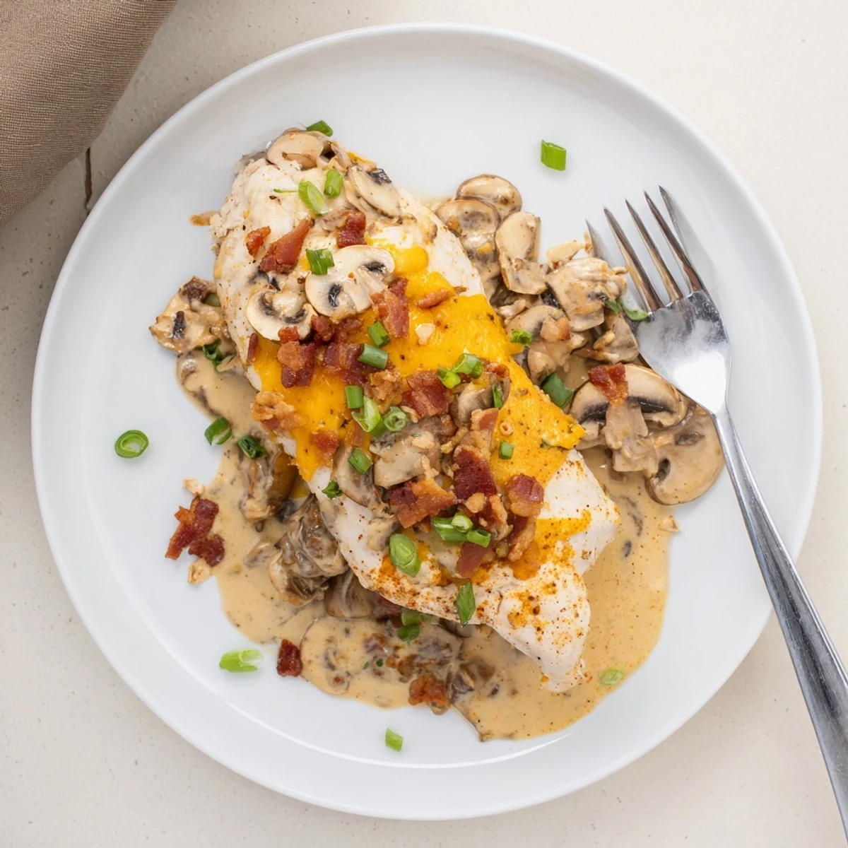 Hearty Mississippi Mud Chicken with melted cheddar, sautéed mushrooms and savory bacon