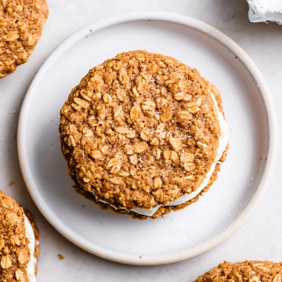 Fresh baked Gluten Free Oatmeal Creme Pies on cooling rack, cinnamon aroma.