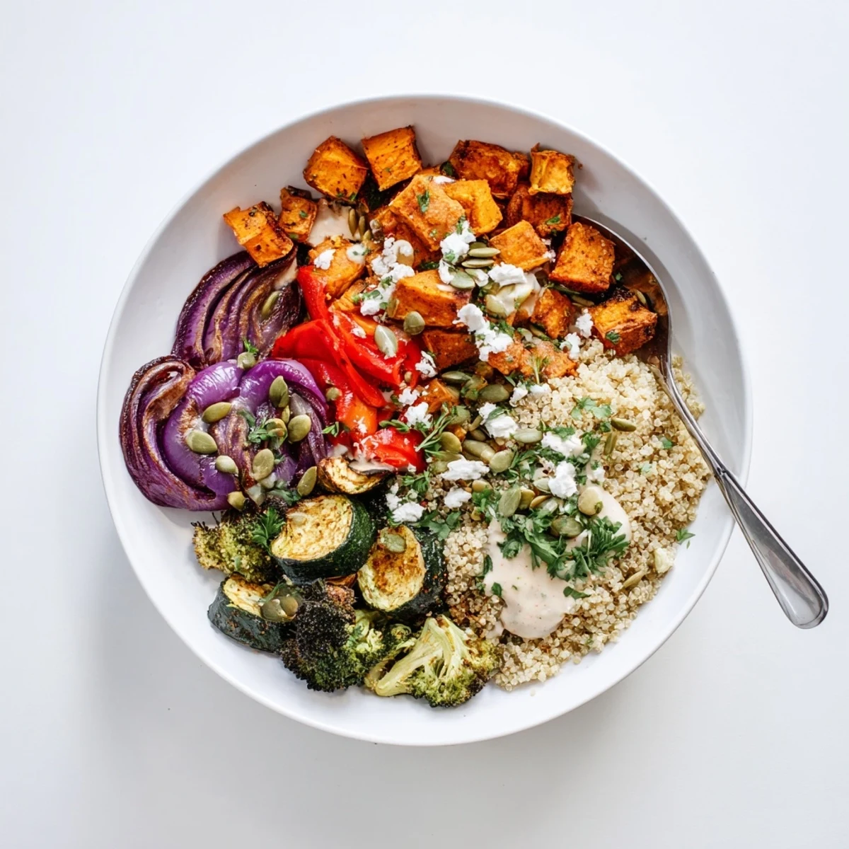 Hearty grain bowl with roasted vegetables featuring golden sweet potato and tender broccoli