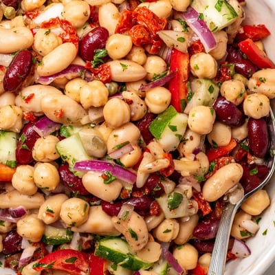 Hearty Dense Bean Salad With Sun Dried Tomatoes served chilled with crusty bread